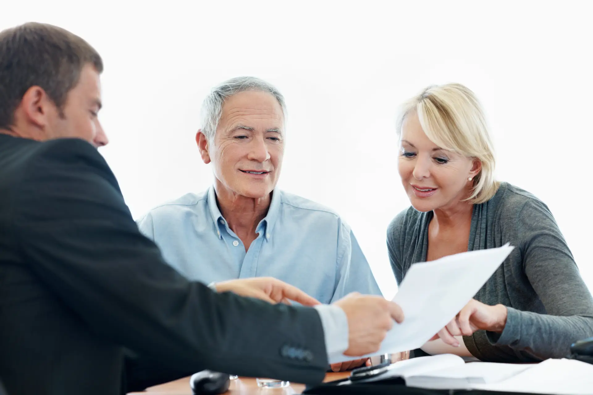 An older couple talking through options with an adviser